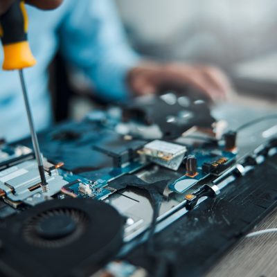 Screwdriver, motherboard circuit or Information technology man fixing laptop hardware, electronics